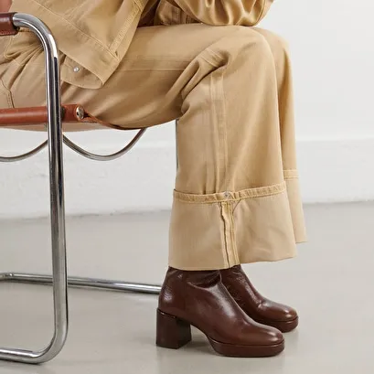 Round-toe boots in aged brown leather