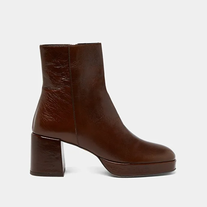 Round-toe boots in aged brown leather