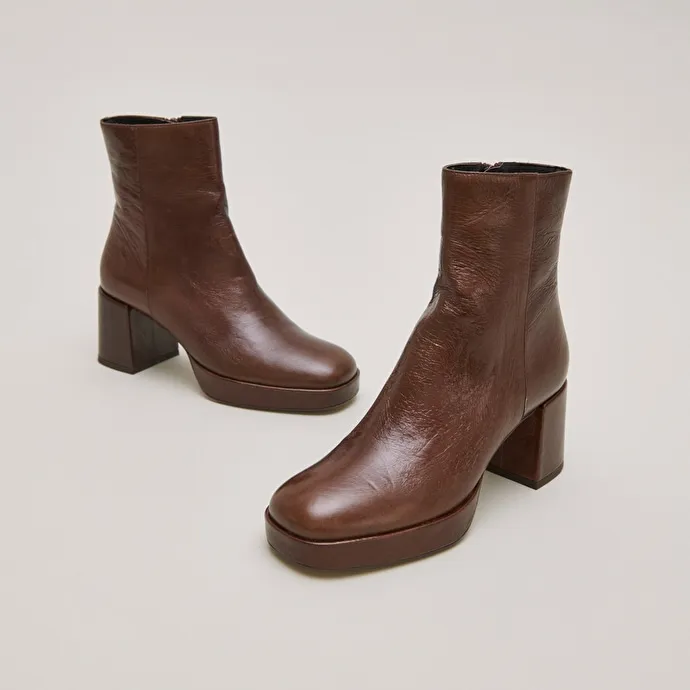 Round-toe boots in aged brown leather