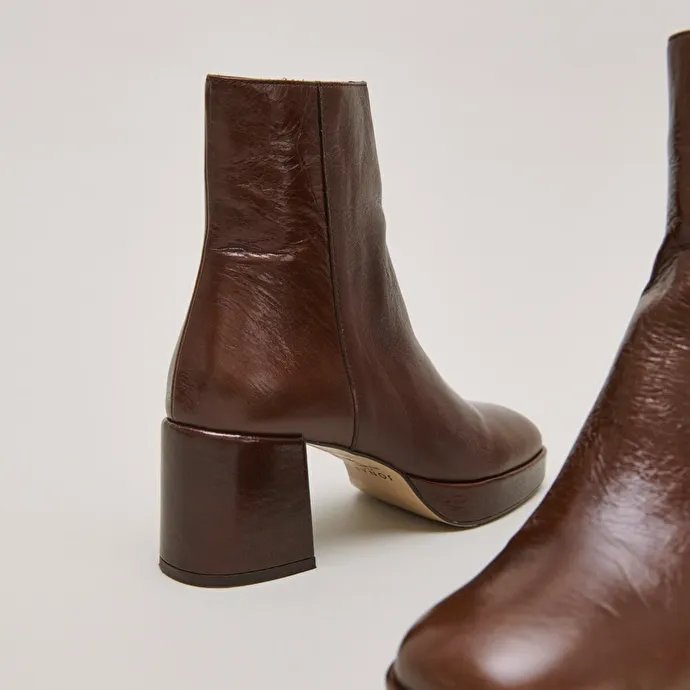 Round-toe boots in aged brown leather