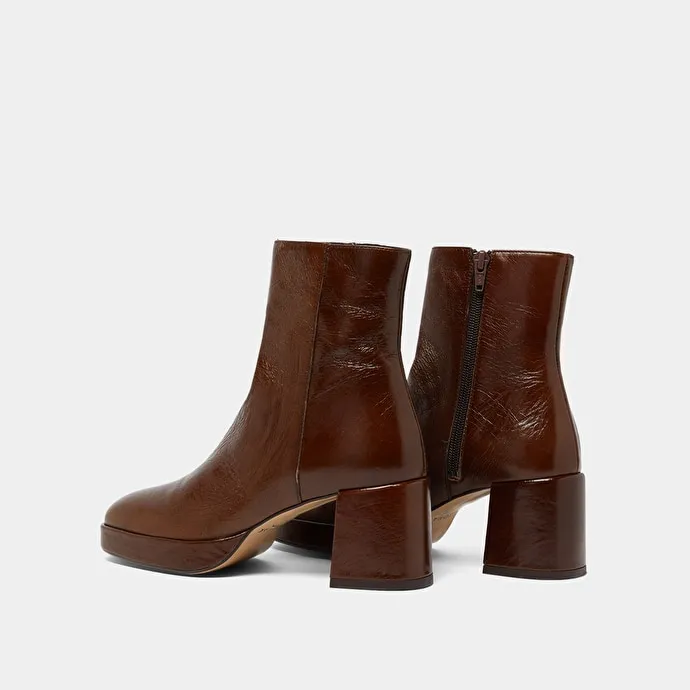 Round-toe boots in aged brown leather