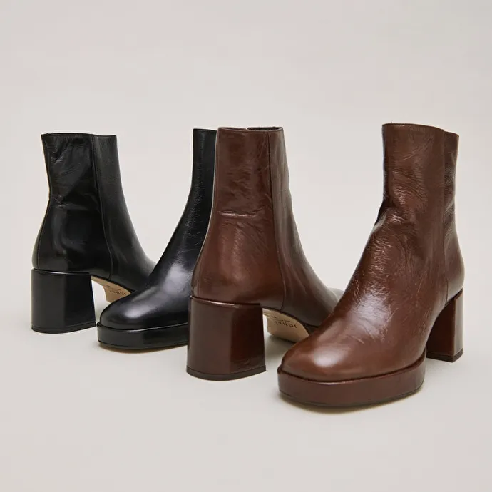 Round-toe boots in aged brown leather